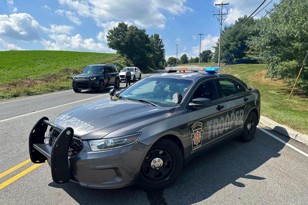 Police vehicles block a road near Chester County Prison where convicted murderer Danelo Cavalcante escaped last week as they continue to search for him, Wednesday, Sept. 6, 2023, in Pocopson Township, Pa.