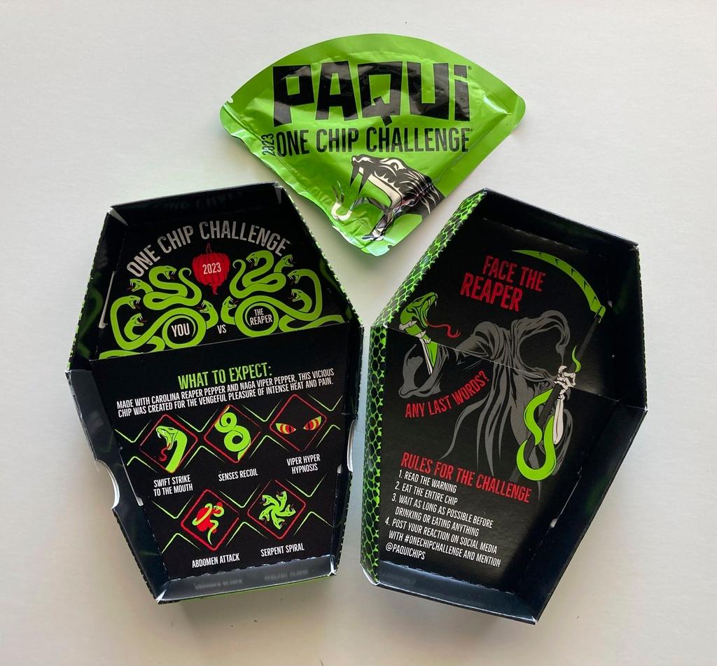The One Chip Challenge chip sells for about $10 and comes wrapped in a sealed foil pouch that is enclosed in a coffin-shaped cardboard box. 