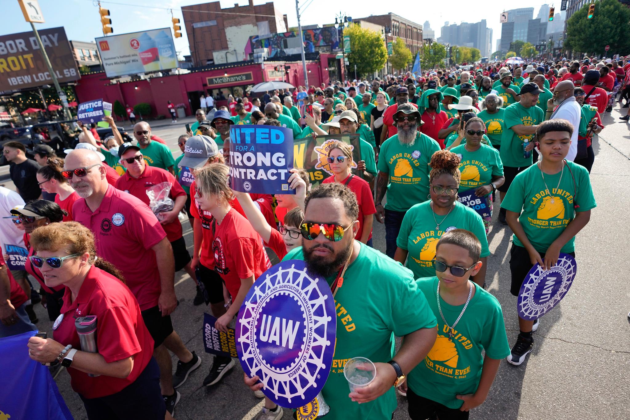 United Auto Workers members walk in the Labor Day parade in Detroit on Sept. 4, 2023.