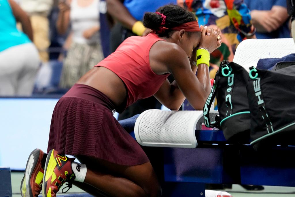 Coco Gauff, of the United States, kneels in prayer after defeating Aryna Sabalenka, of Belarus, in the women's singles final of the U.S. Open tennis championships