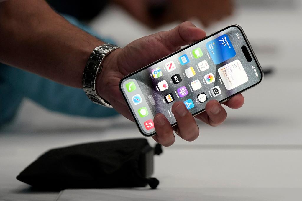 Person holding iPhone 15 Pro