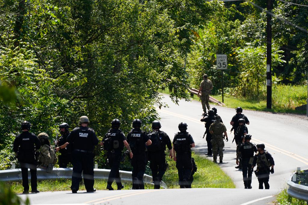 Law enforcement officers gather as the search for escaped convict Danelo Cavalcante continues Tuesday, Sept. 12, 2023, in Pottstown, Pa.