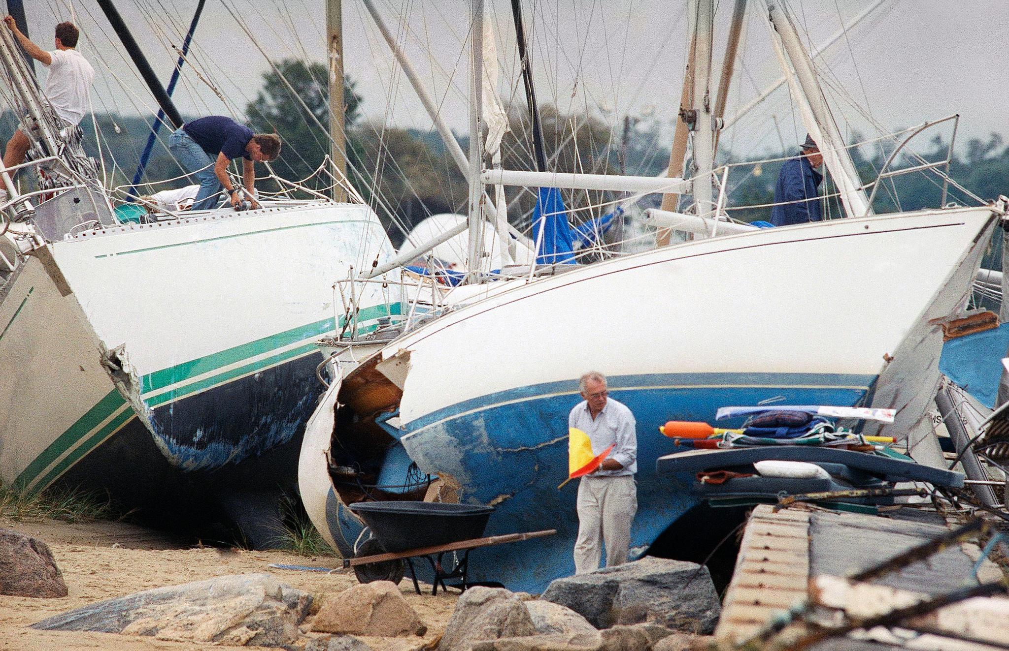 Boat owners assess damage after a 1991 storm.