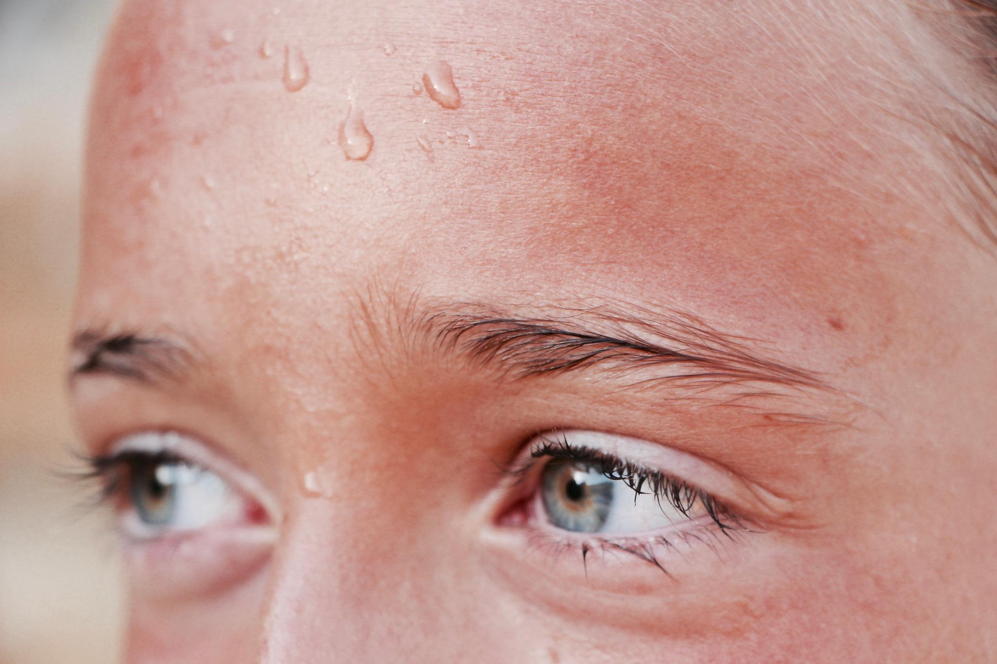 woman with sweaty forhead