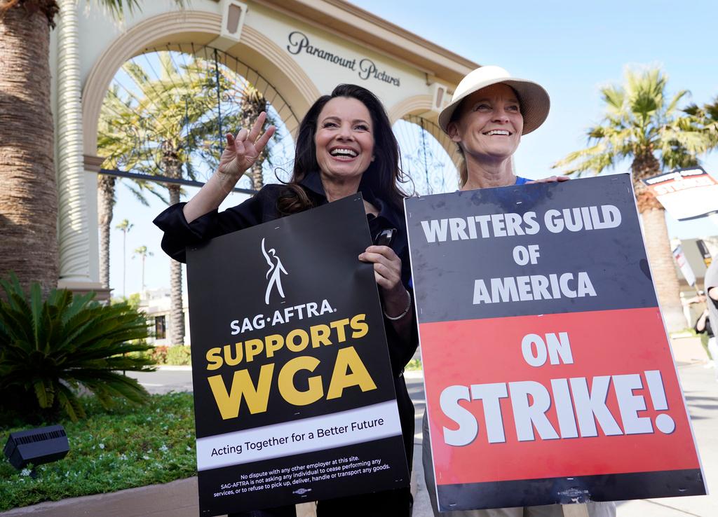 Fran Drescher, left, president of SAG-AFTRA, and Meredith Stiehm, president of Writers Guild of America West, pose together during a rally by striking writers outside Paramount Pictures studio in Los Angeles on May 8, 2023.