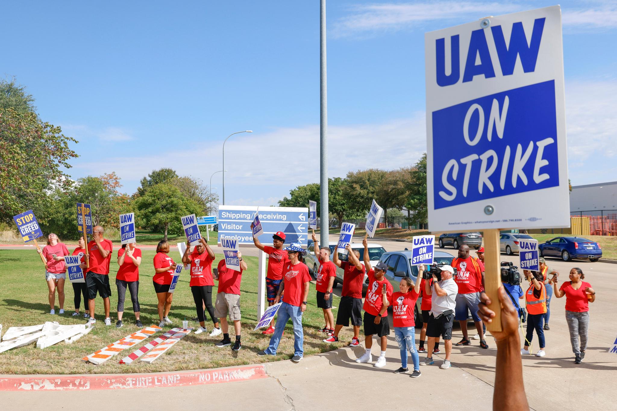 UAW members cheer as employees walkout from the General Motors' Fort Worth Parts Distribution Center, on Friday, Sept. 22, 2023, in Roanoke, Texas.