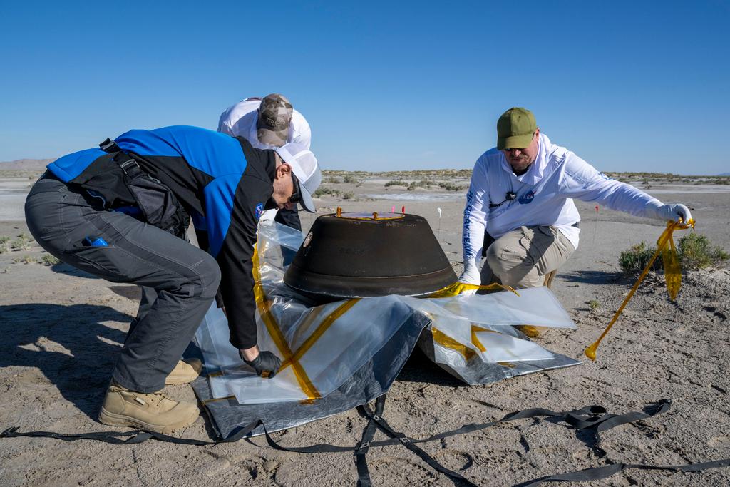prepare the sample return capsule from NASA's Osiris-Rex mission for transport after it landed at the Department of Defense's Utah Test and Training Range 