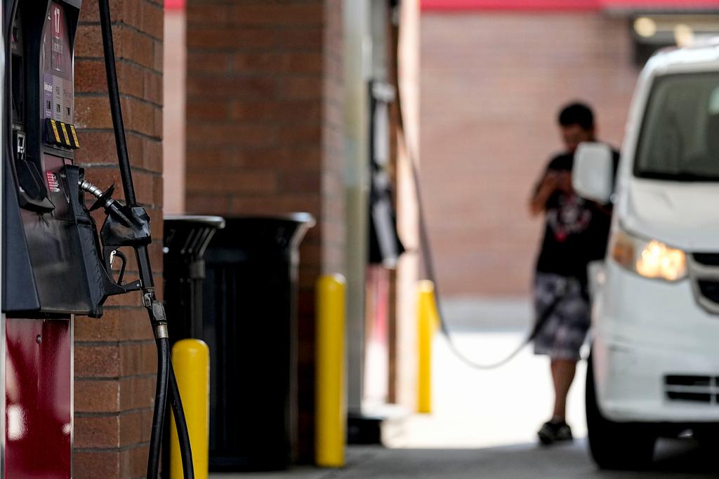 A person pumps gas, on Sept. 12, 2023, in Marietta, Ga.
