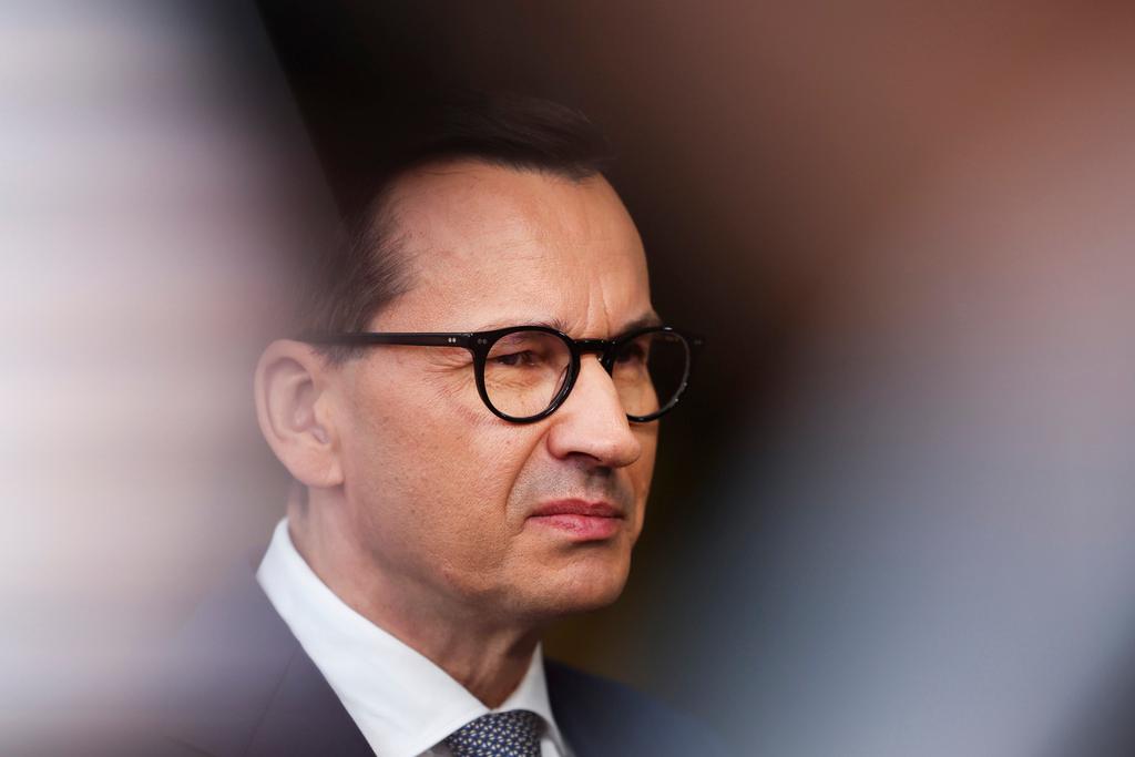 Poland's Prime Minister Mateusz Morawiecki talks to journalists as he arrives for the third EU-CELAC summit in Brussels, Belgium, Tuesday, July 18, 2023.