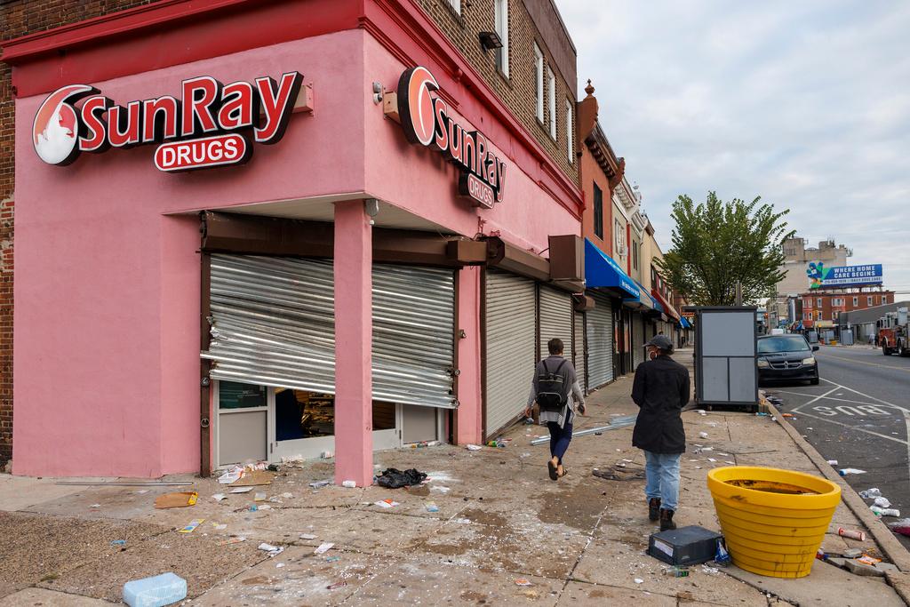 People navigate the damage from vandalism in Philadelphia