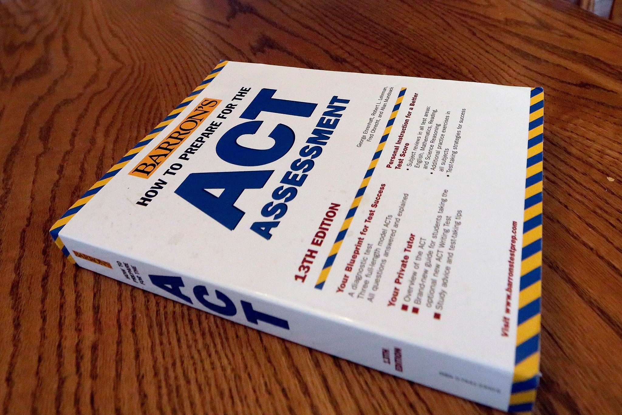 An ACT Assessment preparation book is seen, April 1, 2014, in Springfield, Ill. High school students' scores on the ACT college admissions test for 2023 dropped to their lowest in more than three decades, showing a lack of student preparedness for college-level coursework, the nonprofit organization that administers the test said Wednesday, Oct. 11, 2023.