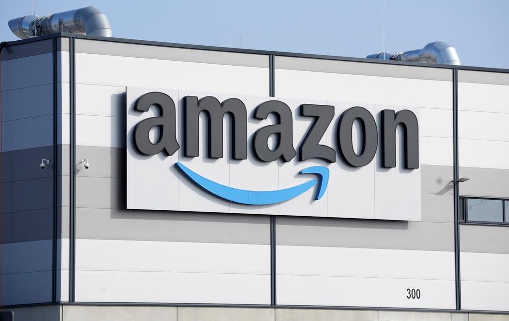 An Amazon company logo marks the facade of a building, March 18, 2022, in Schoenefeld near Berlin.