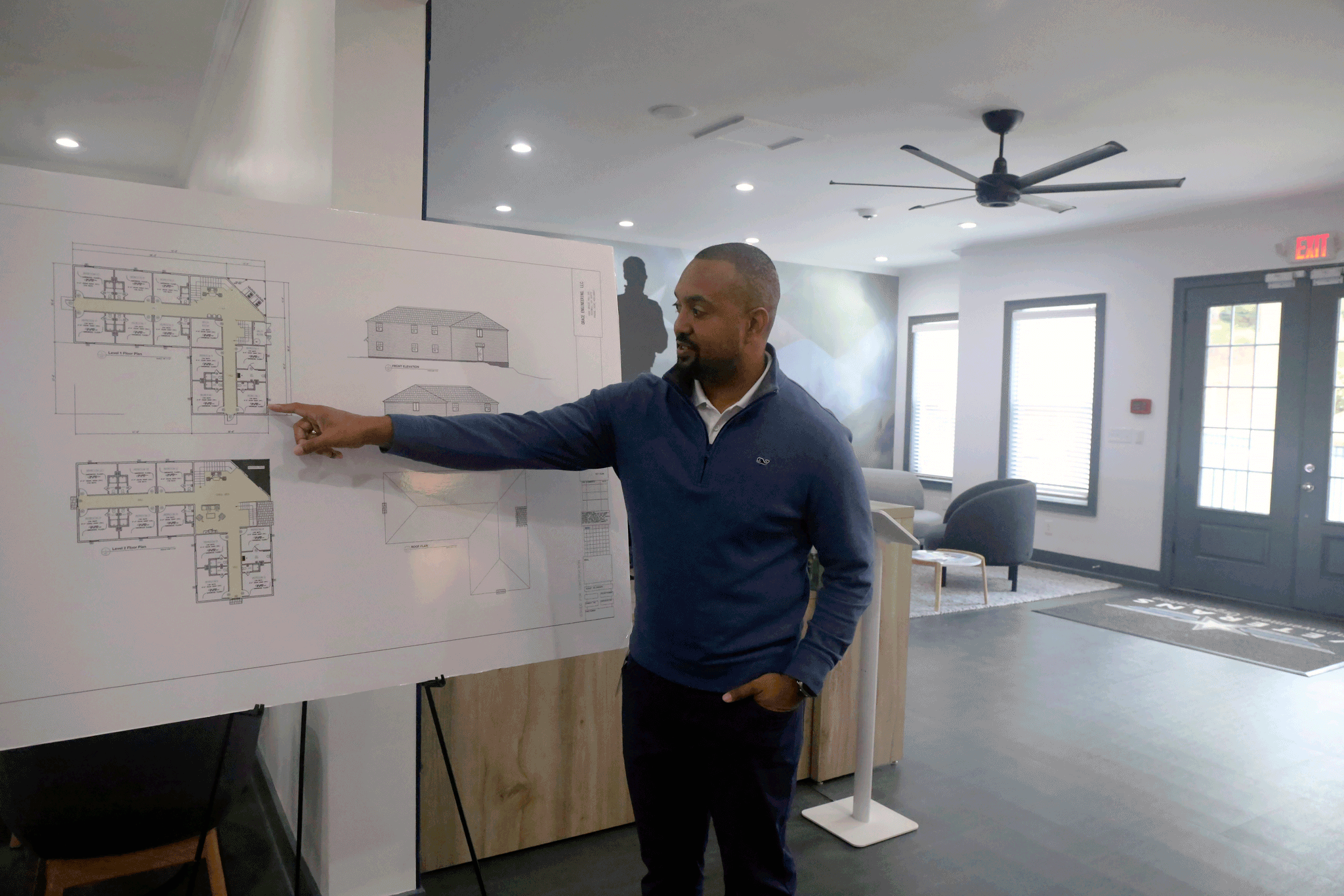 Veterans Empowerment Organization CEO Tony Kimbrough points at design plans for a two-story building that will house 20 formerly homeless veterans, Tuesday, Oct. 31, 2023 in Atlanta.