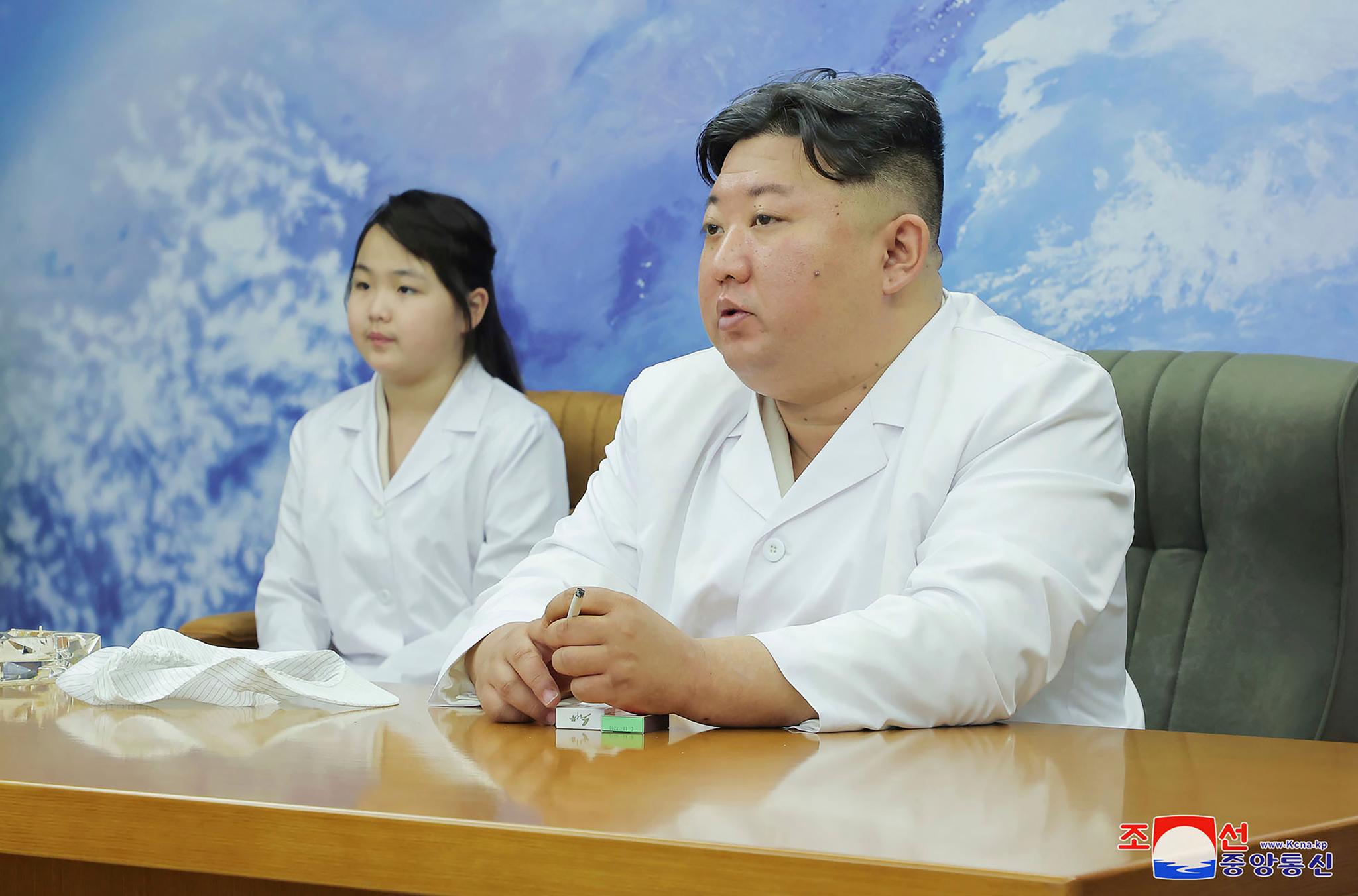 In this photo provided by the North Korean government, North Korean leader, Kim Jong Un, right, and his daughter visit the country's aerospace agency North Korea, on May 16, 2023.