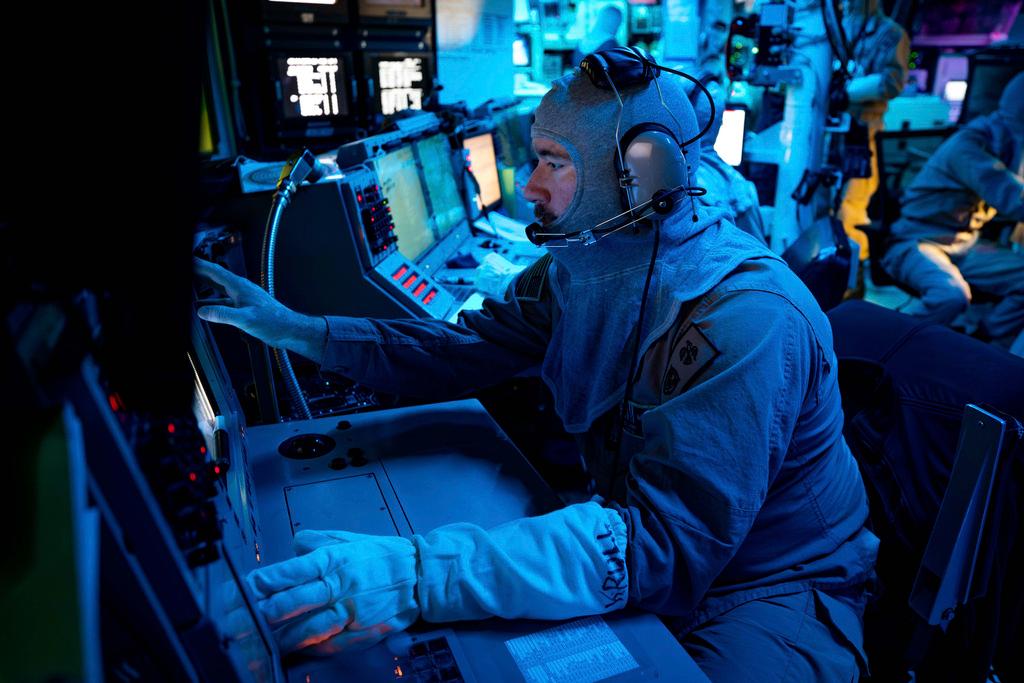 U.S. Navy, Chief Fire Controlman, Kenneth Krull, mans combat systems coordinator console on Navy ship
