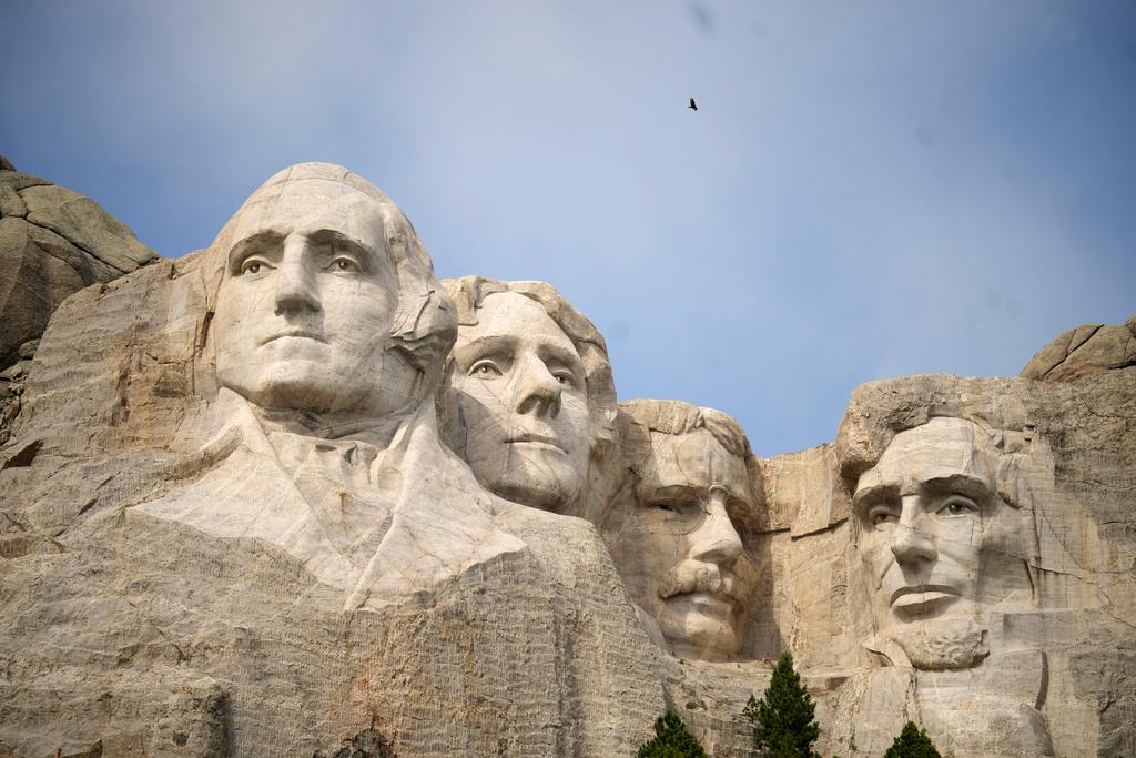 Visitors take in the massive sculpture carved into Mount Rushmore at the Mount Rushmore National Memorial Thursday, Sept. 21, 2023, in, Keystone, S.D.