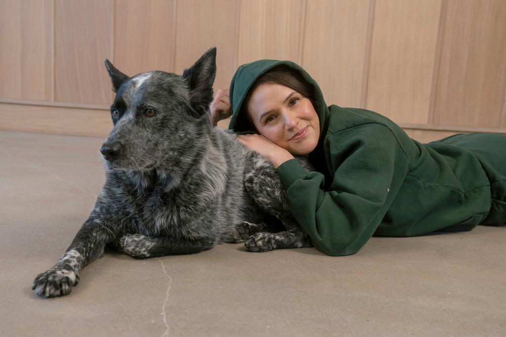 lady laying with dog