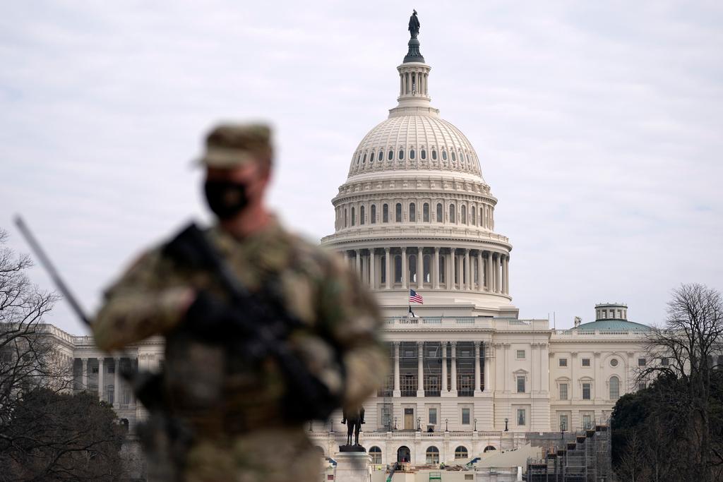 Member of the National Guard patrols area outside the U.S. Capitol