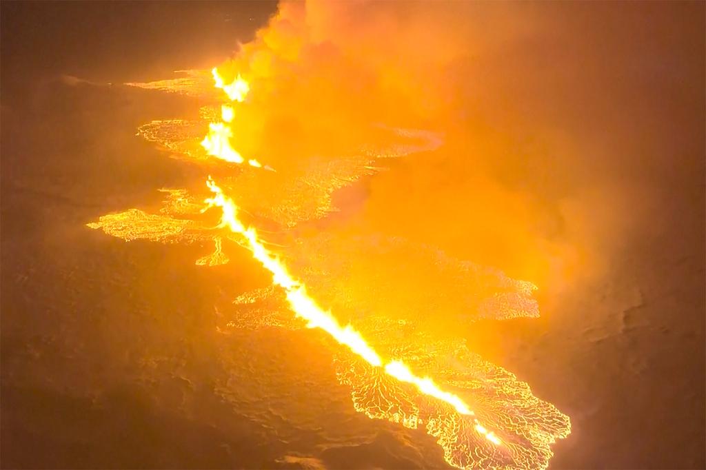 This image made from video provided by the Icelandic Coast Guard shows magma flow on a hill near Grindavik on Iceland's Reykjanes Peninsula sometime around late Monday, Dec. 18, or early Tuesday, Dec. 19, 2023.