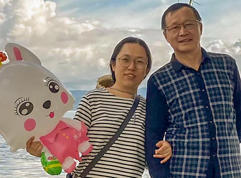 Church elder Ding Zhongfu and his wife Ge Yunxia pose for a photo as they visit Dali, in southwestern China's Yunnan province