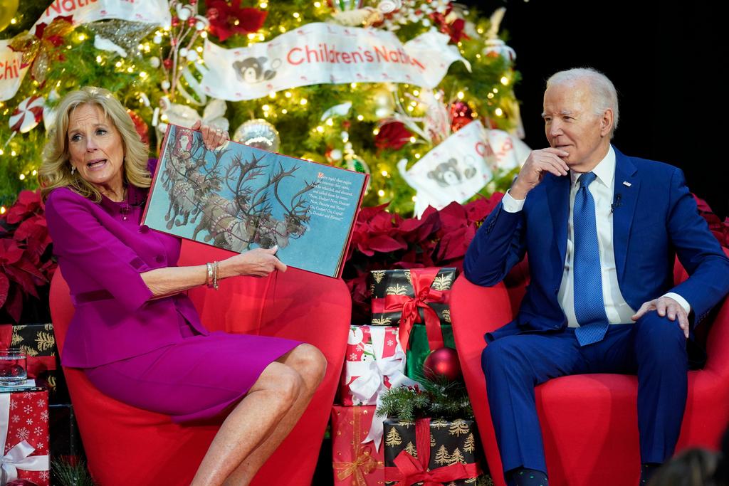 First lady Jill Biden, accompanied by President Joe Biden, reads "Twas the Night Before Christmas" at Children's National Hospital