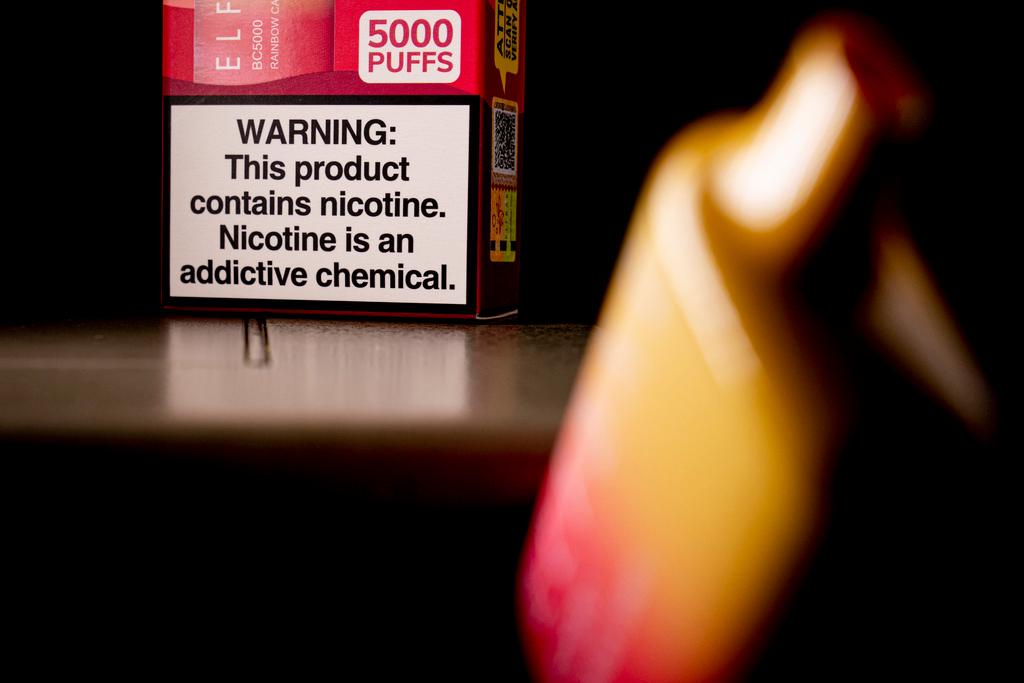 A health warning is seen on the packaging of a disposable vaping pod device in Washington on Monday, June 26, 2023.