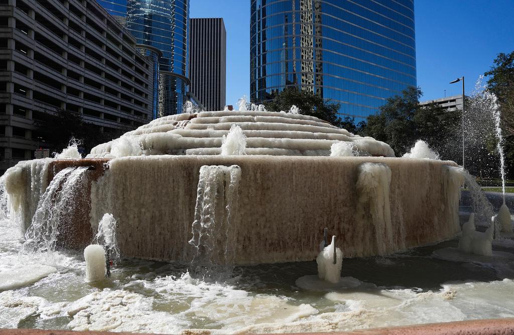 Fountain at Antioch Park in downtown Houston still runs as ice forms on it