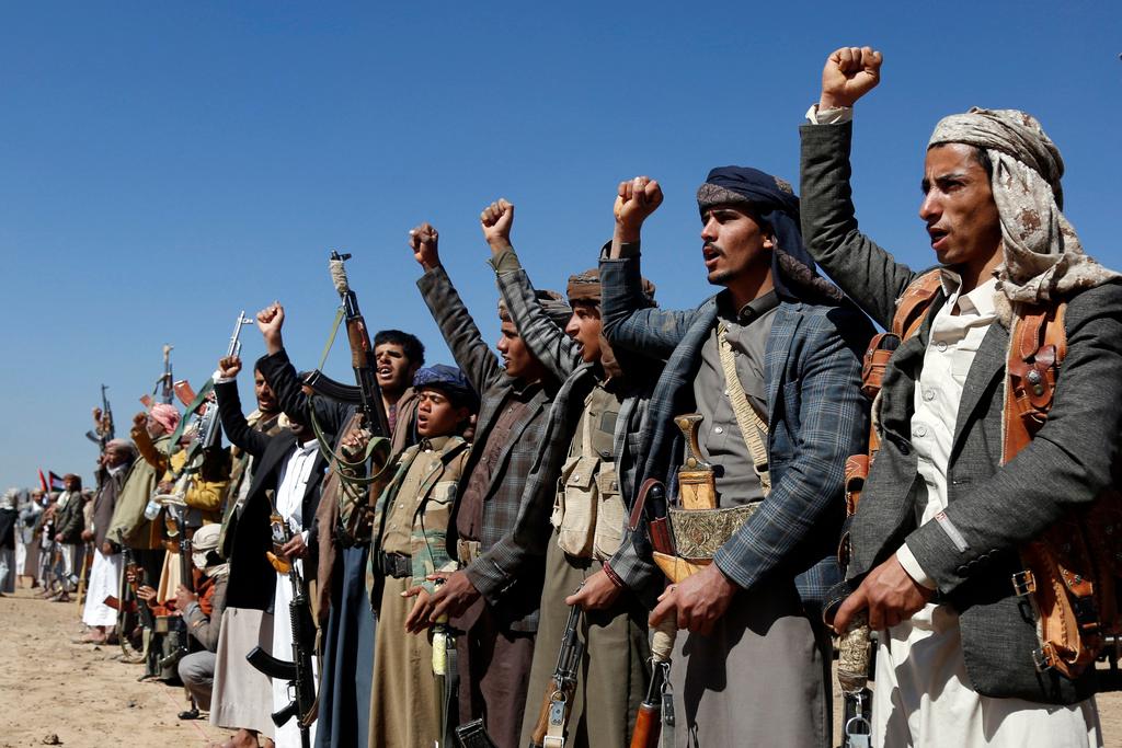 Houthi fighters and tribesmen stage a rally against the U.S. and the U.K. strikes on Houthi-run military sites near Sanaa, Yemen