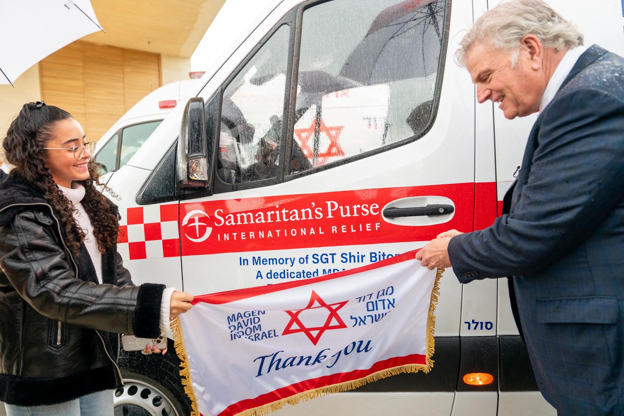 Franklin Graham with a family member who lost loved one