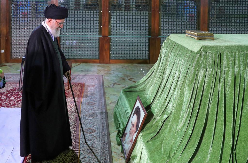 Supreme Leader Ayatollah Ali Khamenei prays at the grave of the late revolutionary founder Ayatollah Khomeini, just outside Tehran