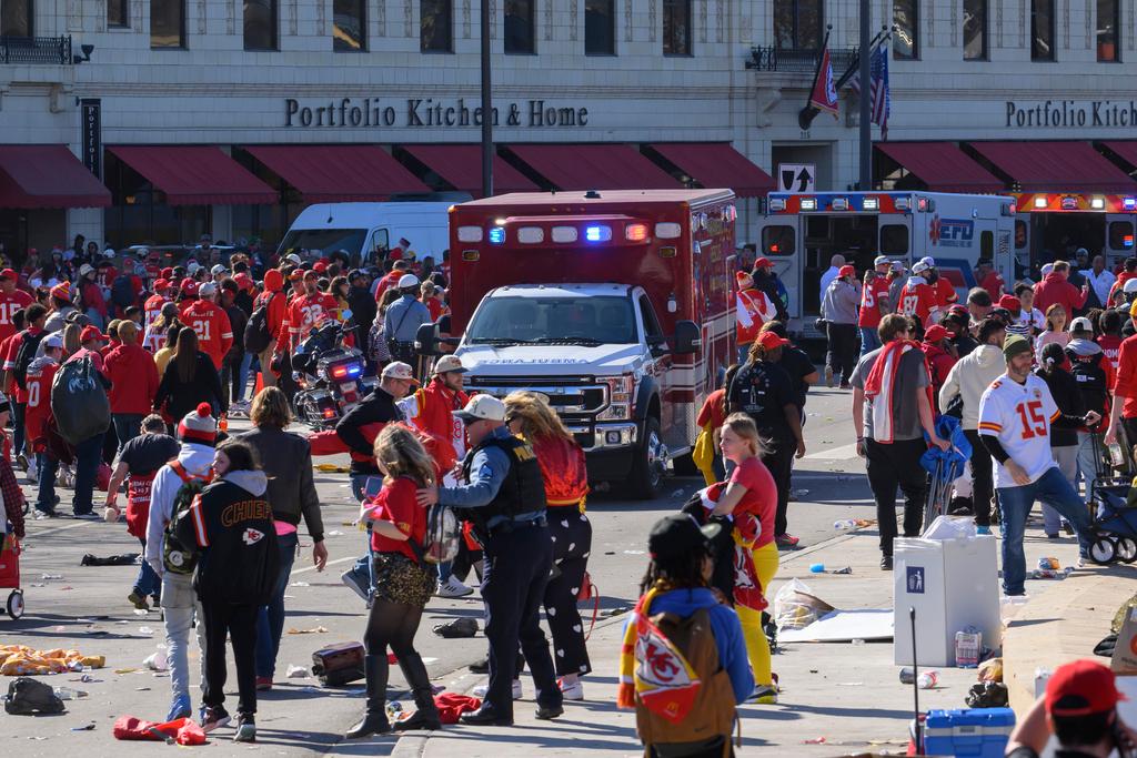 Police clear the area following a shooting at the Kansas City Chiefs NFL football Super Bowl celebration in Kansas City, Mo.