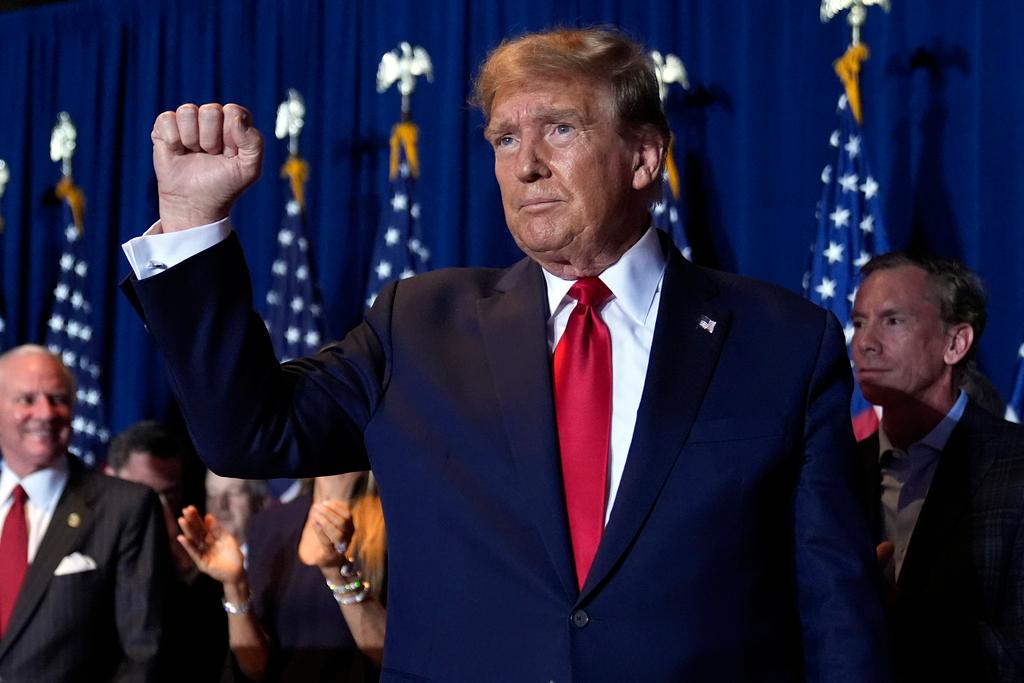 Donald Trump reacts at a primary election night party at the South Carolina State Fairgrounds