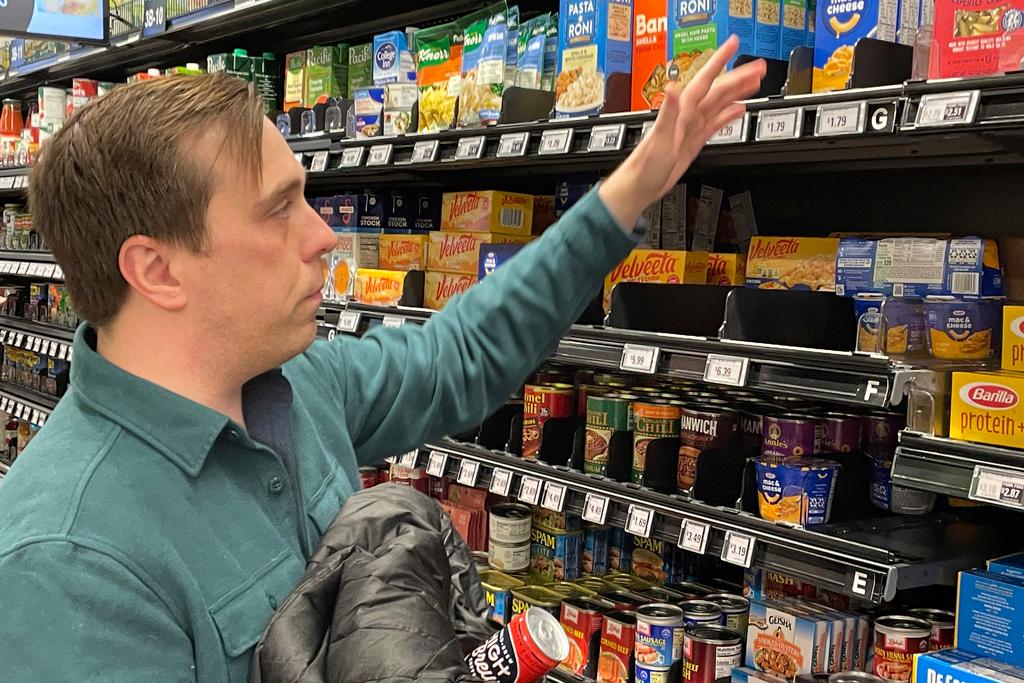 Stuart Dryden reaches for an item in Arlington, Va.