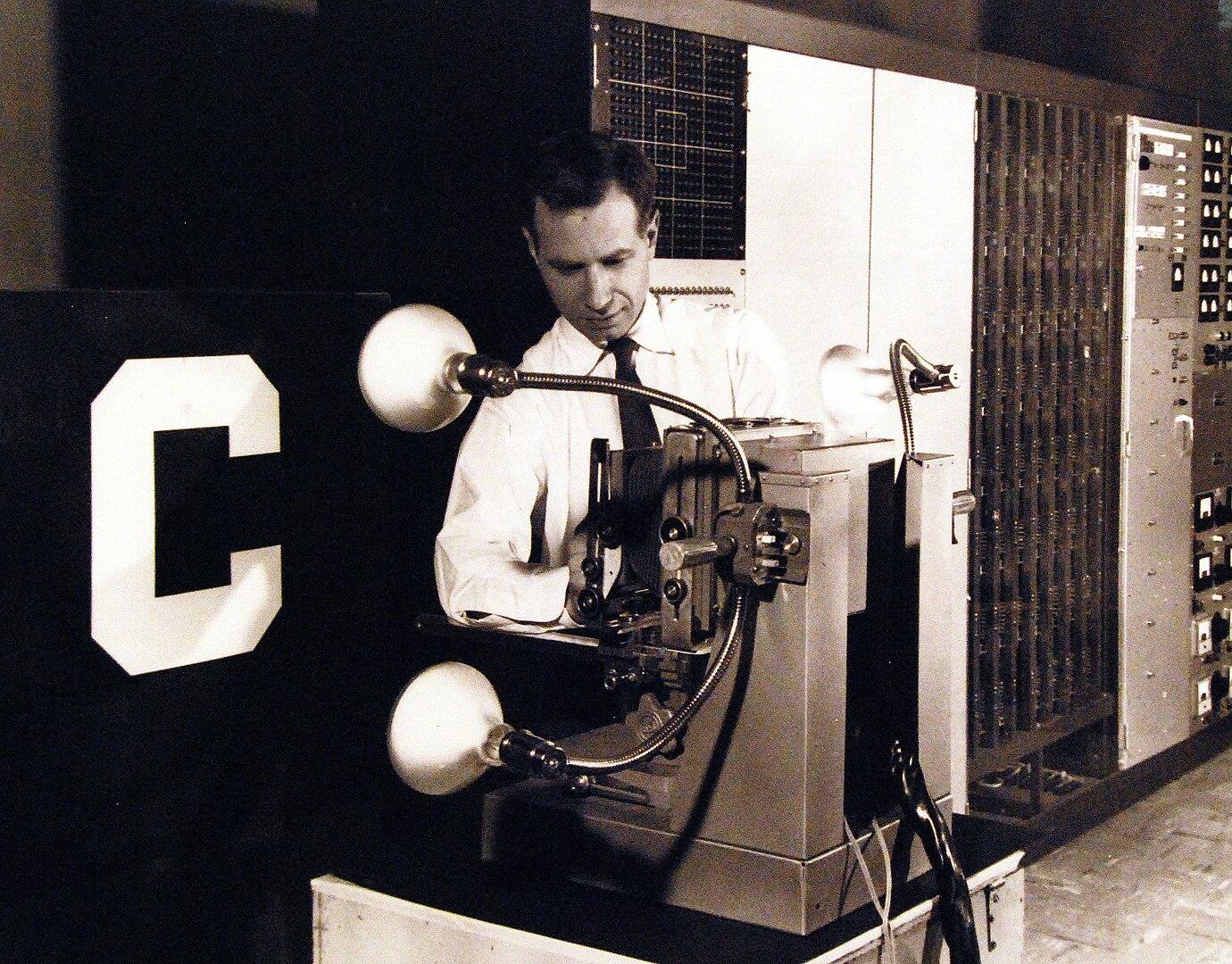 The Mark 1 Perceptron, being adjusted by Charles Wightman (Mark I Perceptron project engineer)