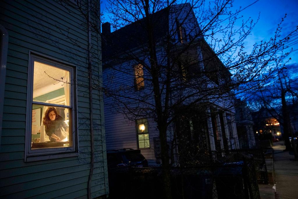 Person seen inside her home through a window