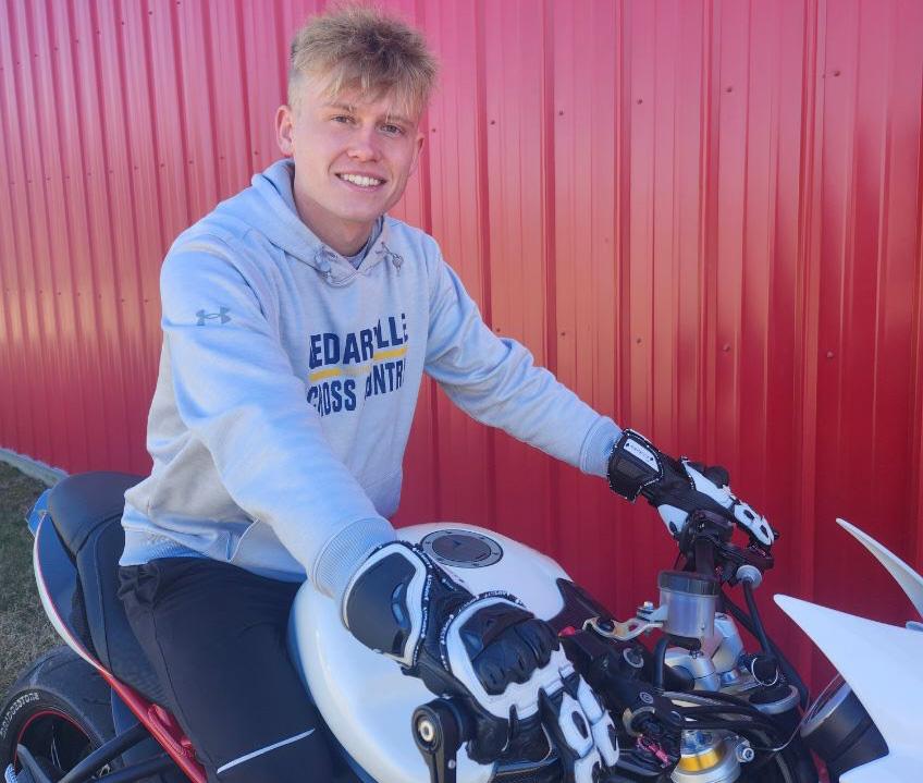 Ethan Wallis models the motorcycle gloves he designed 