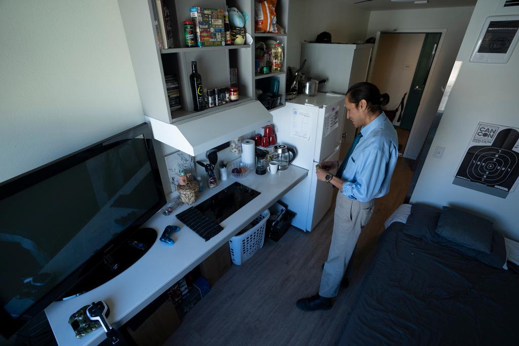 Cheyenne Welbourne stands in his micro-apartment at The Starlight affordable housing building that is run by Central City Concern, a Portland-based homeless services nonprofit, on Friday, March 15, 2024, in Portland, Ore.