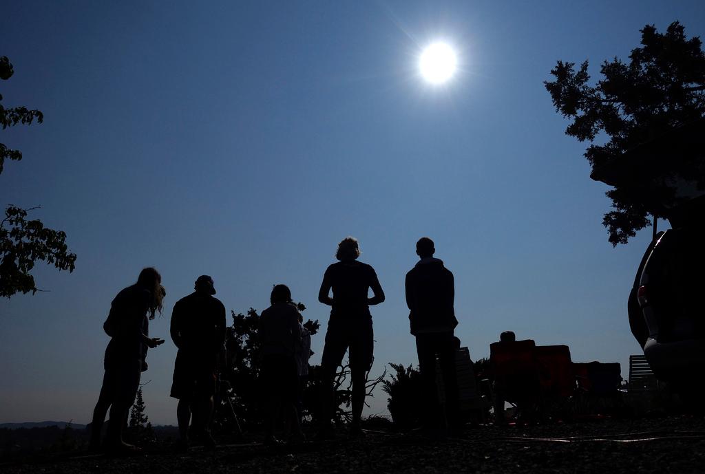  People gather near Redmond, Ore., to view the sun as it nears a total eclipse by the moon in 2017. The April 8, 2024 total solar eclipse in North America first hits land at Mexico’s Pacific coast, cuts diagonally across the U.S. from Texas to Maine and exits in eastern Canada.