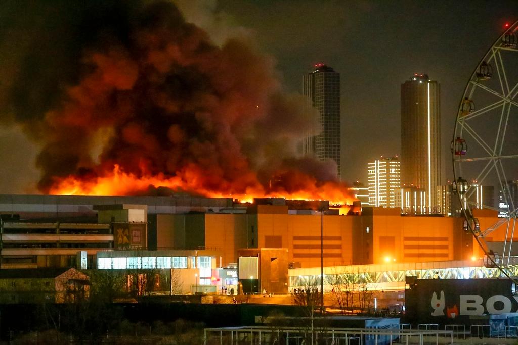 A massive blaze is seen over the Crocus City Hall on the western edge of Moscow, Russia
