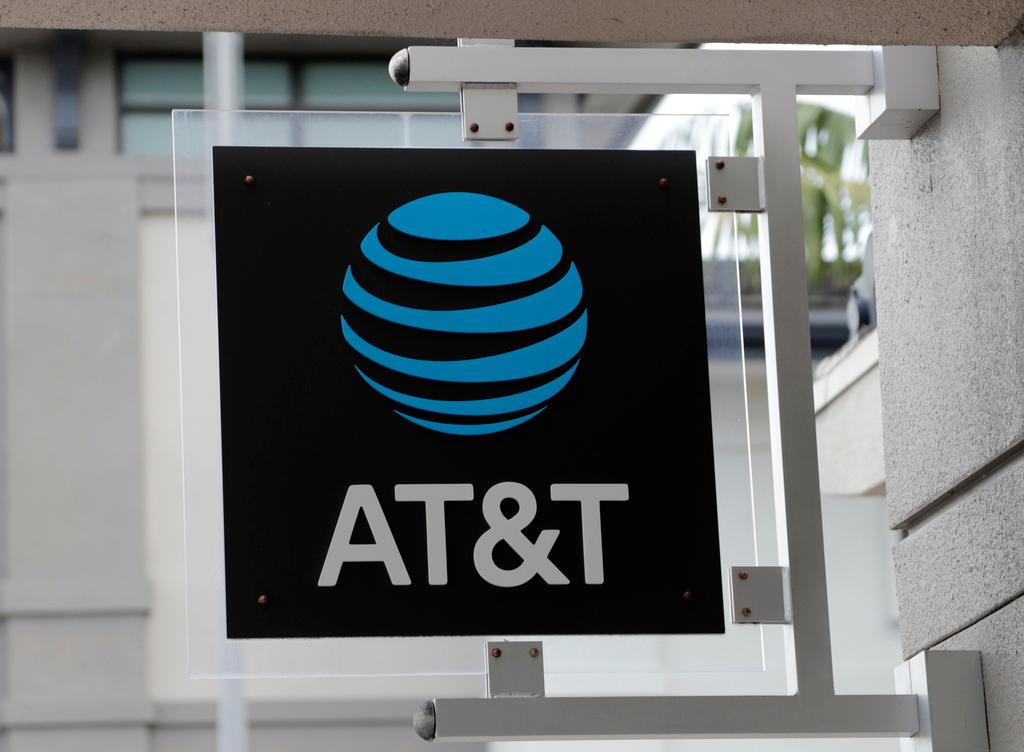 The sign in front of an AT&T retail store is seen in Miami, July 18, 2019. 