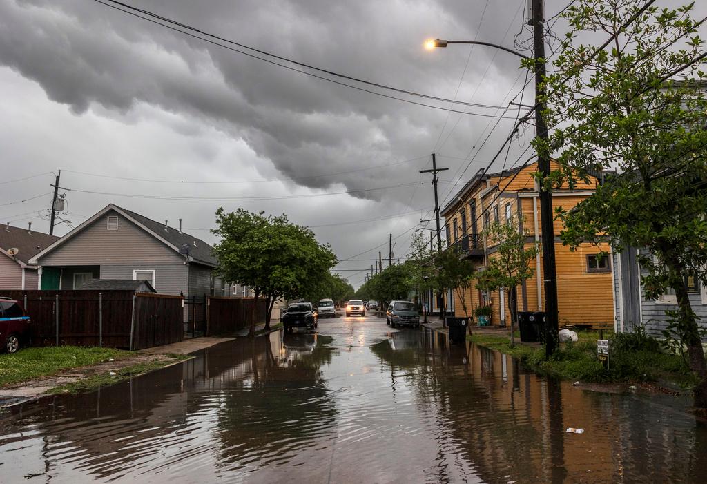 Storm clouds roll across New Orleans as water rises in the Treme neighborhood 
