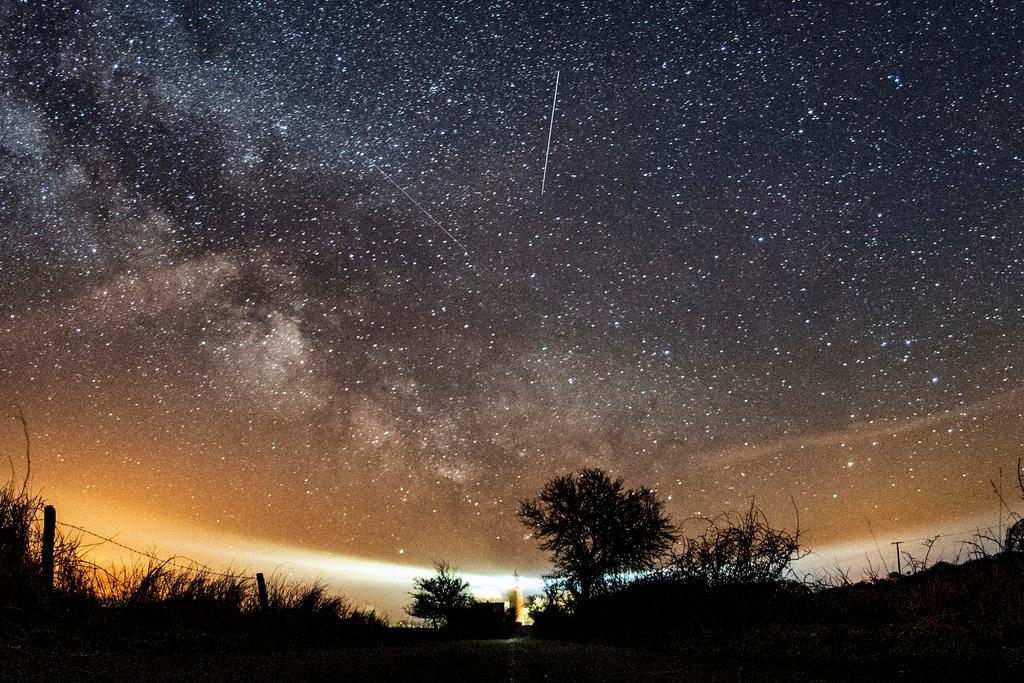 The Lyrid meteor shower is seen over Burg on the Baltic Sea island of Fehmarn off Germany, Friday, April 20, 2018.