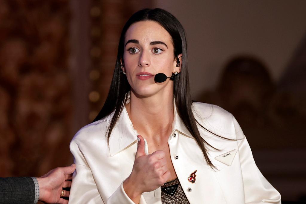 Indiana Fever's Caitlin Clark reacts during an interview during the WNBA basketball draft 