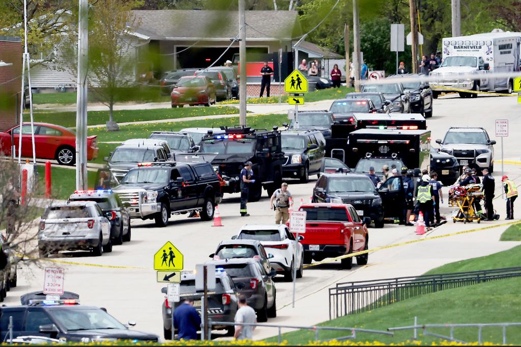 Law enforcement personnel respond to a report of a person armed with a rifle at Mount Horeb Middle School 