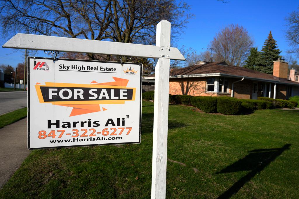 A 'For Sale' sign displayed in front of a home