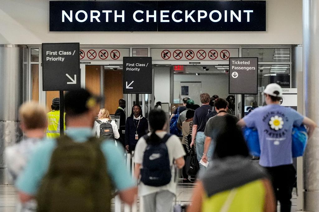 Travelers move through Hartsfield-Jackson Atlanta International Airport ahead of Memorial Day