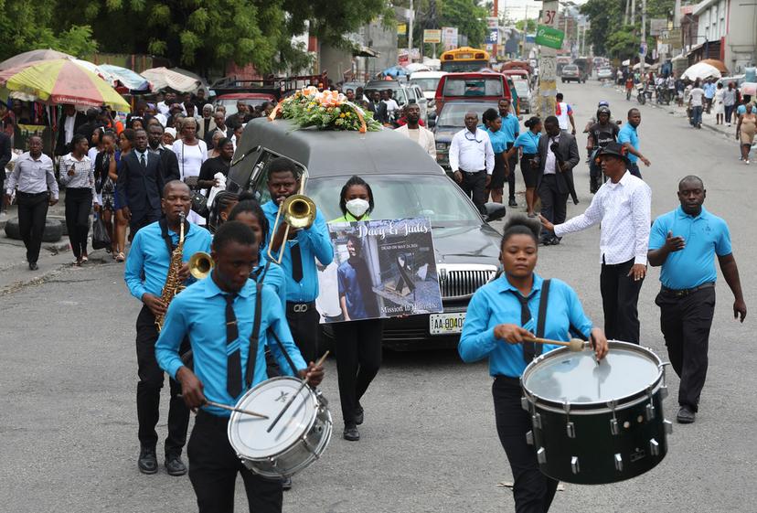A funeral procession for mission director Judes Montis, killed by gangs alongside two of his U.S. missionary members, makes its way to the cemetery after his funeral ceremony in Port-au-Prince, Haiti