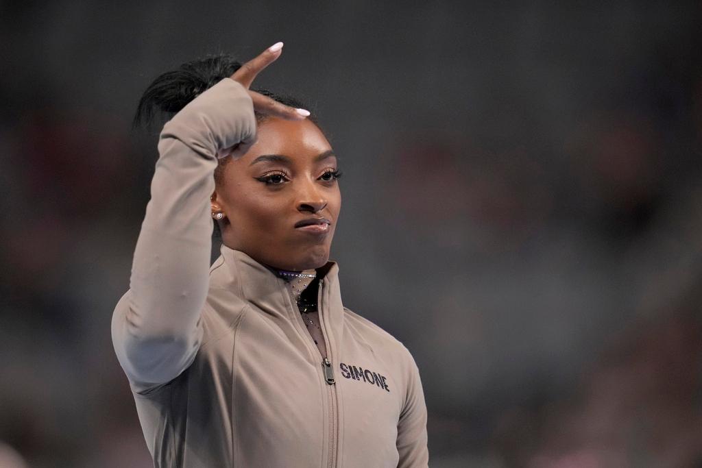 Simone Biles gestures during introductions for the U.S. Gymnastics Championships Sunday, June 2, 2024, in Fort Worth, Texas.