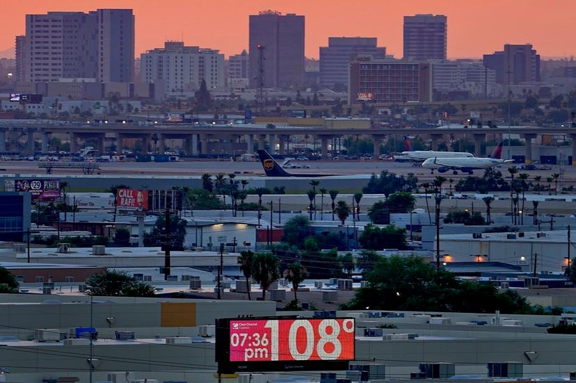 The unofficial temperature hits 108 degrees at dusk at Sky Harbor International Airport in Phoenix on July 12, 2023.