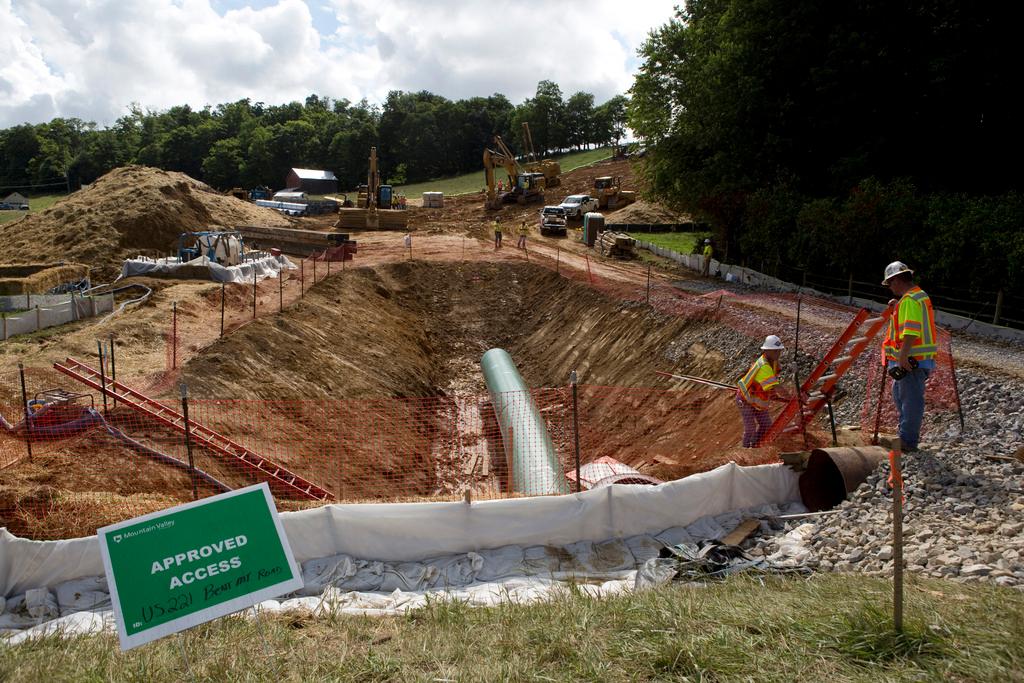  Construction crews bore beneath U.S. 221 in Roanoke County, Va., June 22, 2018, to make a tunnel through which the Mountain Valley Pipeline will pass under the highway. 